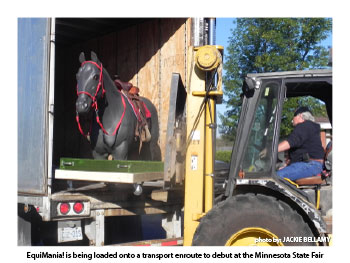 EquiMania! is being loaded onto a transport enroute to debut at the Minnesota State Fair 