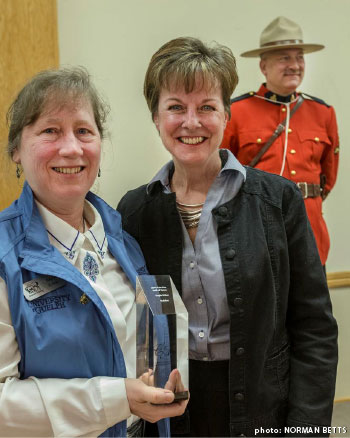 Gayle Ecker holding Builder Award